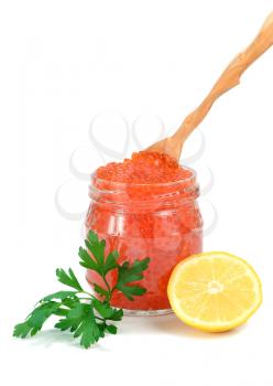 caviar red in a glass jar with lemon and parsley isolated on white background