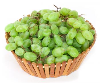 green grapes in a basket on a white background