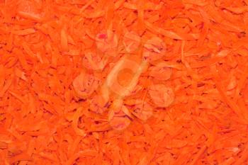 Grated carrots background. Close-up. 