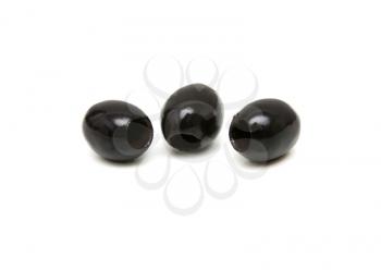 Three black olives shot on white background 