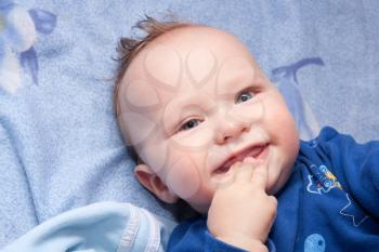 Closeup portrait of cute smiling baby boy