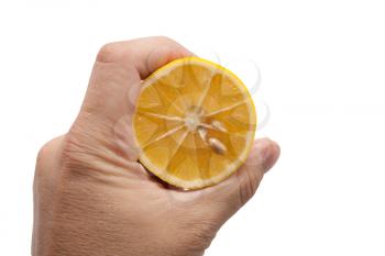 lemon in his hand on a white background