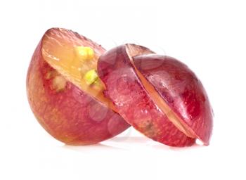 Translucent slice of red grape fruit, macro isolated on white 