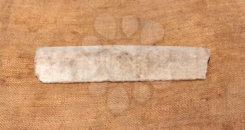 splinter asbestos pipe on fa background of the rough sackcloth