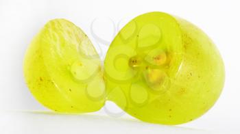 Translucent slice of green grape fruit, macro isolated on white 