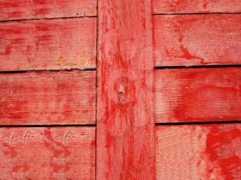Closing on red wooden panels of the fence     