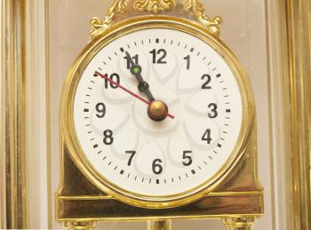  Golden antique watch against 