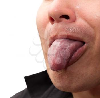 man shows tongue on a white background