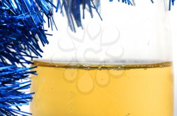 champagne with blue tinsel on a white background