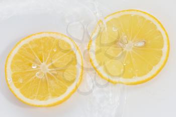 lemon in water on a white background