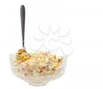 salad with a spoon on a white background