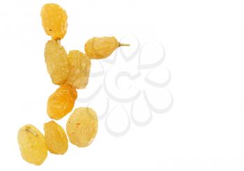yellow raisins on a white background. macro