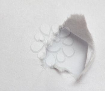 Hole ripped non color paper. White background