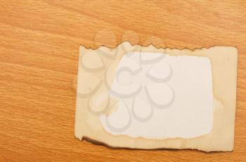 Old paper over vintage wooden surface