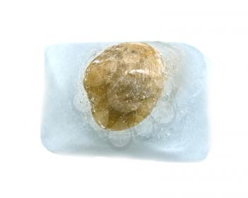 stone in the ice cube on a white background