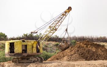 excavator digging a big bucket