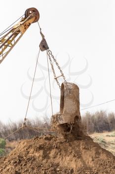 excavator digging a big bucket