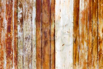 Old rusty metal fence as an abstract background .
