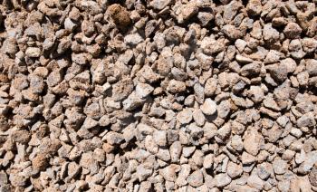 Crushed stone with sand as a background .