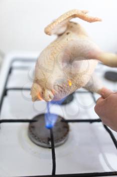 singeing chicken on fire