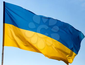 flag of Ukraine against the blue sky .