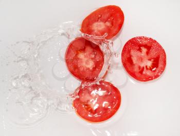 tomato in water on white background