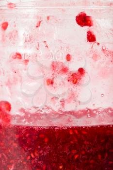 background of raspberry jam in a jar. macro