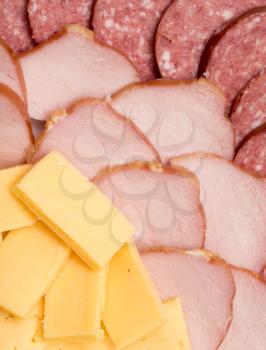 background of cheese and sausages