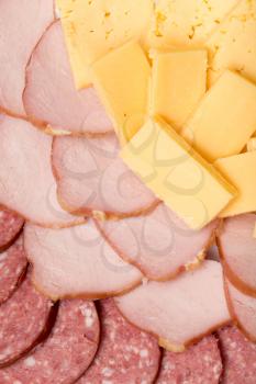 background of cheese and sausages