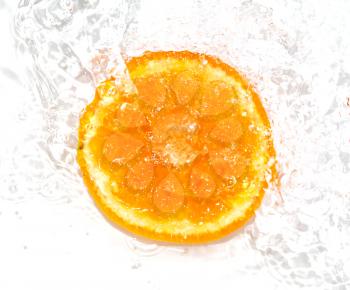 orange in water on a white background. macro