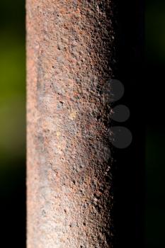 rusty pipe on black