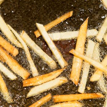 French fries are fried in a pan
