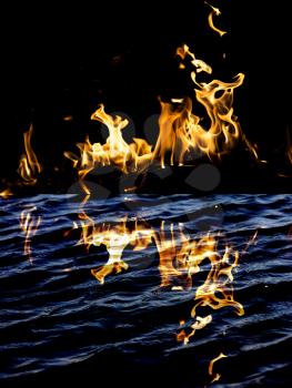 flame fire with reflection in water