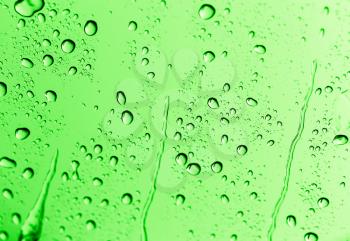 water drops on green glass