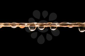 drops of water on a rope. macro