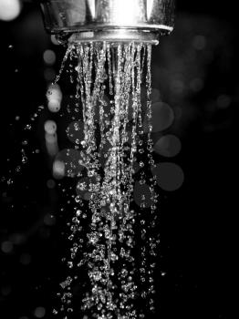 Shower with water isolated on a black background