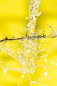 splashes of water on a yellow background