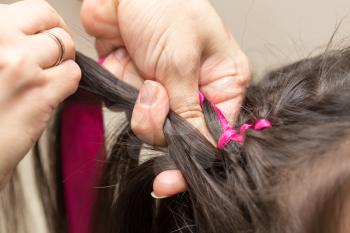 weave braids in a beauty salon