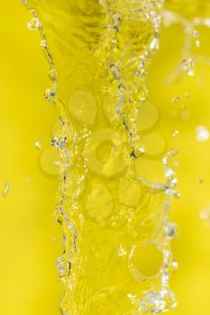 water on a yellow background