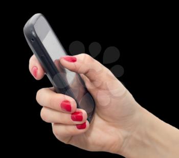Cell phone in hand with red nail polish on a black background