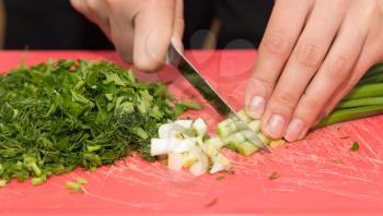 sliced green onions with a knife