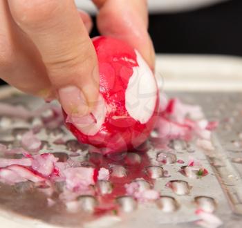 sliced radishes on a grater