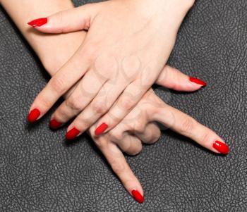 hand with red nail polish. rock