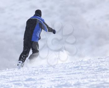 man snowboarding in the winter