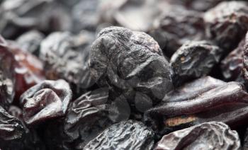 Black raisins as background. macro