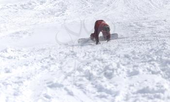 people snowboarding on the snow in the winter