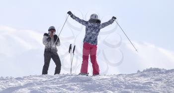 people skiing in the snow in the winter