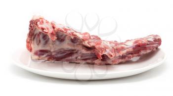 fresh meat in a dish on a white background