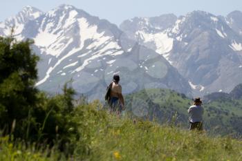 two male traveler in the mountains in nature