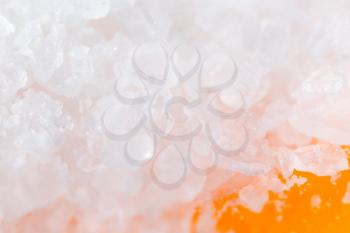 salt on an orange background. macro